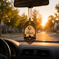 Handcrafted Bismillah Car Charm hanging from a car's center mirror featuring elegant Islamic calligraphy, crescent moon, and mosque silhouette.