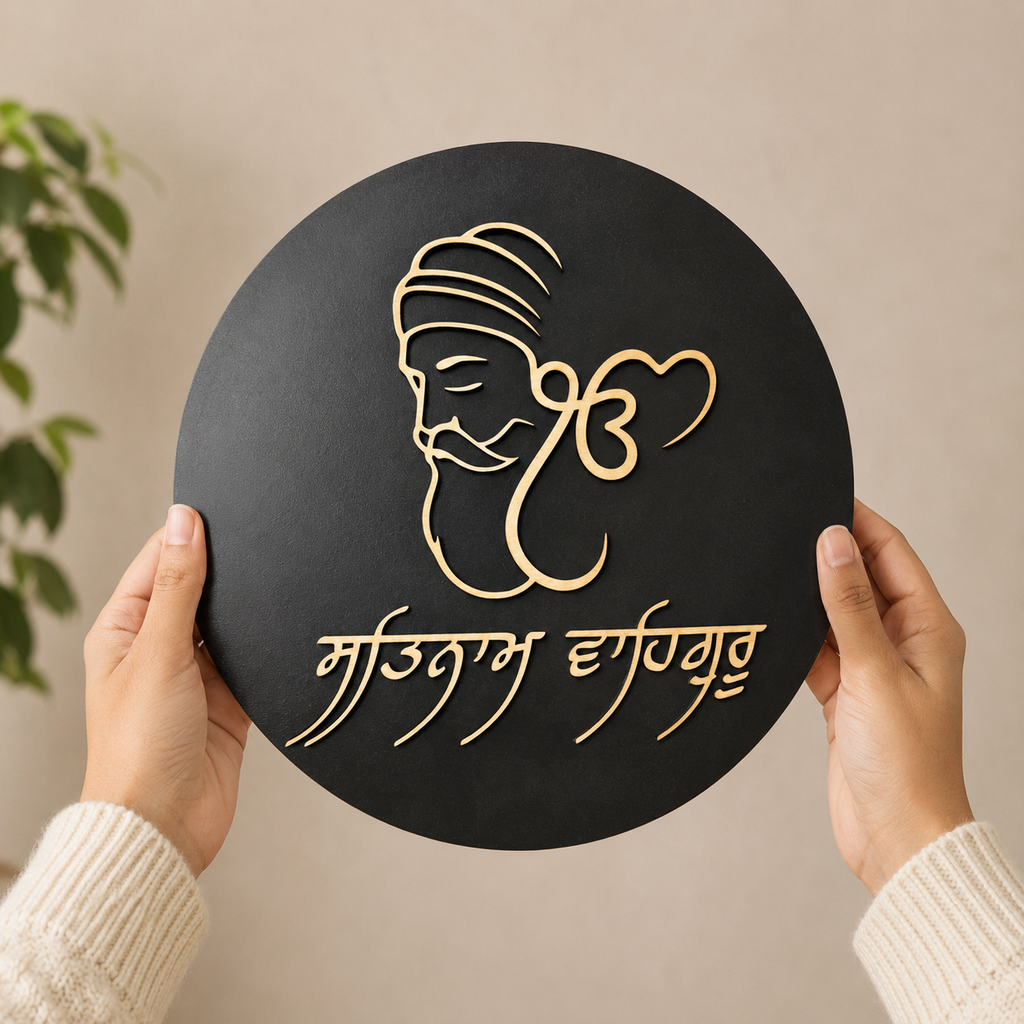 Hands holding the handcrafted Ik Onkar Plaque featuring Guru Nanak Dev Ji artwork, Gurmukhi script, and layered premium wood craftsmanship.