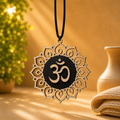 Handcrafted wooden OM Car Charm featuring a layered Om symbol and lotus mandala, designed for a car's center mirror.