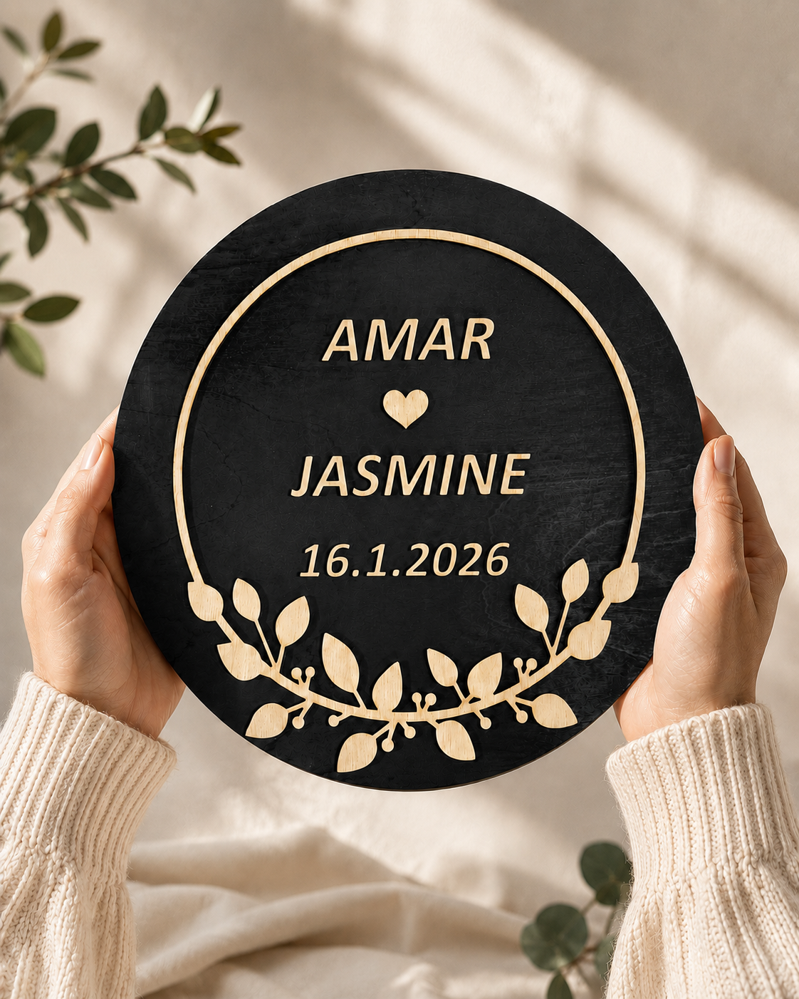 Hands holding a handcrafted Personalized Wedding Wreath made from layered premium wood featuring custom names and wedding date.