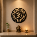 Sacred OM Mandala wooden wall art displayed in a Hindu pooja room with a Ganesha idol and diya, handcrafted from layered wood with a premium finish.
